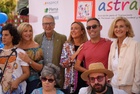 La consejera de Política Social, Conchita Ruiz, junto a usuarios de Astrapace durante la lectura de manifiesto por el Día Mundial de la Parálisis Cerebral