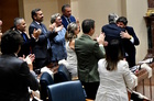 El presidente López Miras y el consejero de Hacienda se abrazan tras la aprobación en la Asamblea Regional del proyecto de Presupuestos Generales...